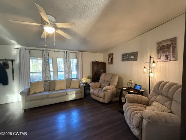 a living room with furniture and a large window