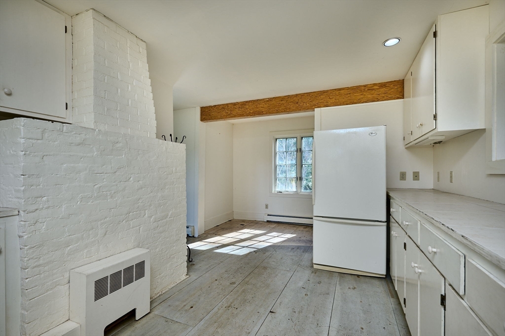 41 Buckland Road Hawley, MA 01339 - Photo 15 of 42 a kitchen with a refrigerator and a stove top oven