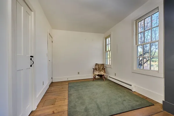 a living room with furniture a window and a fireplace