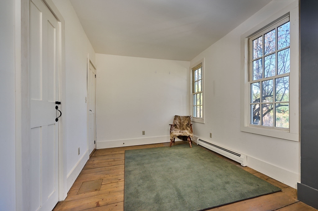 41 Buckland Road Hawley, MA 01339 - Photo 17 of 42 a view of a room with wooden floor and windows