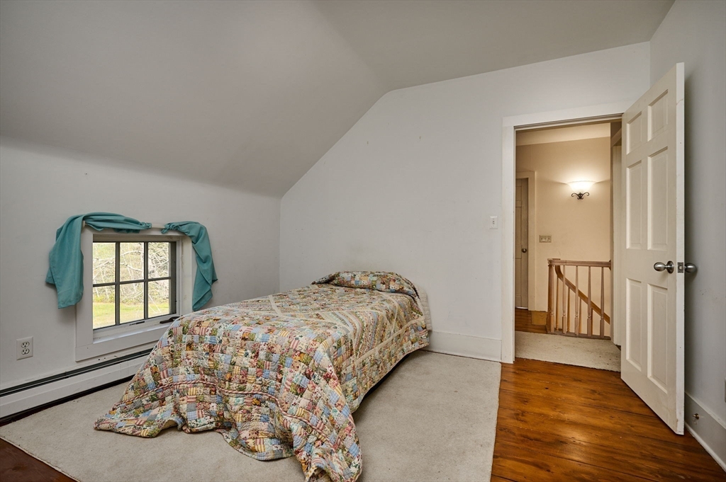 41 Buckland Road Hawley, MA 01339 - Photo 24 of 42 a bedroom with a bed and a window