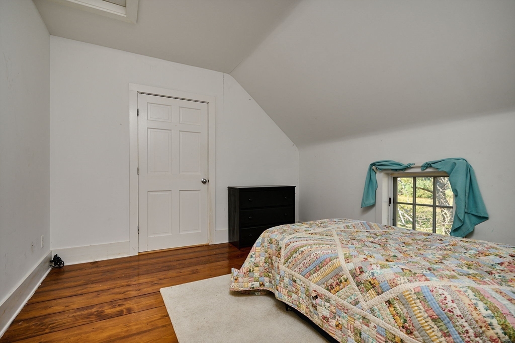 41 Buckland Road Hawley, MA 01339 - Photo 25 of 42 a bedroom with a bed and a window