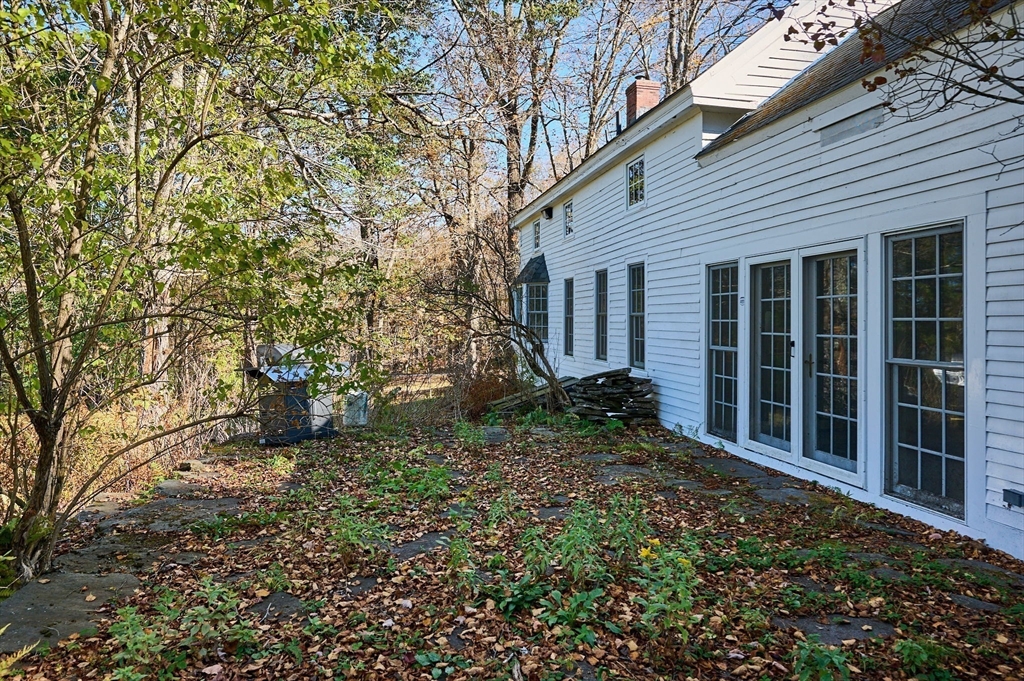41 Buckland Road Hawley, MA 01339 - Photo 30 of 42 a view of a house with a small yard and potted plants