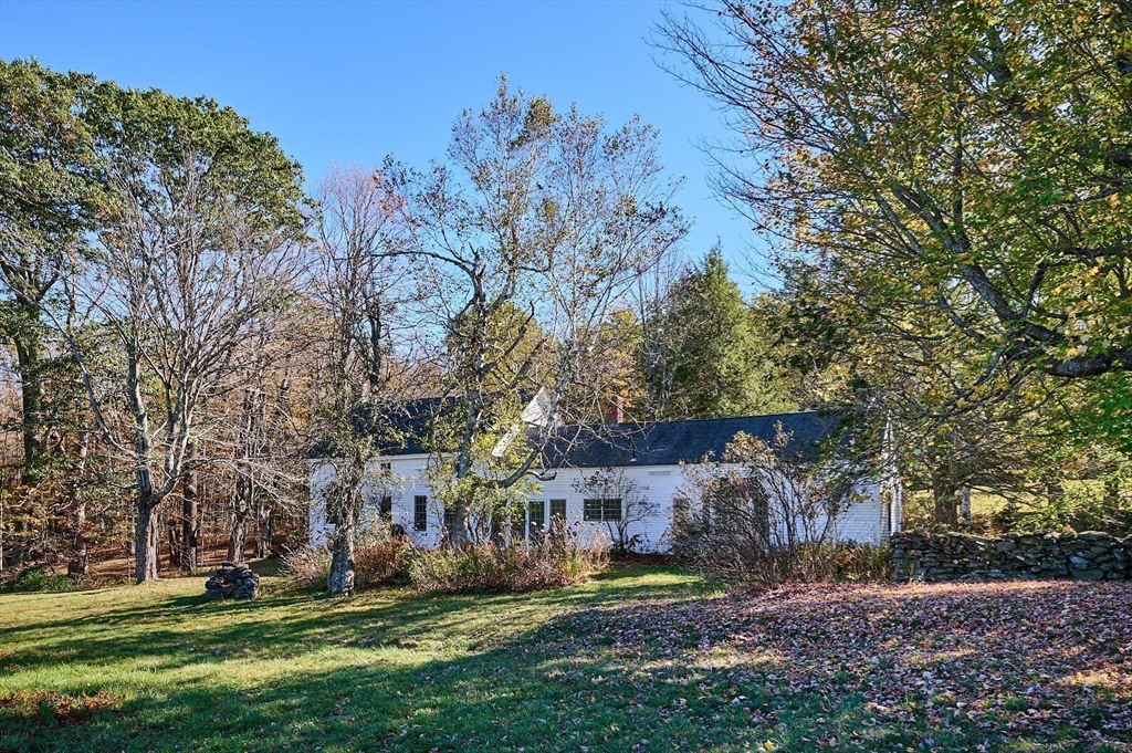 41 Buckland Road Hawley, MA 01339 - Photo 33 of 42 a front view of a house with a garden