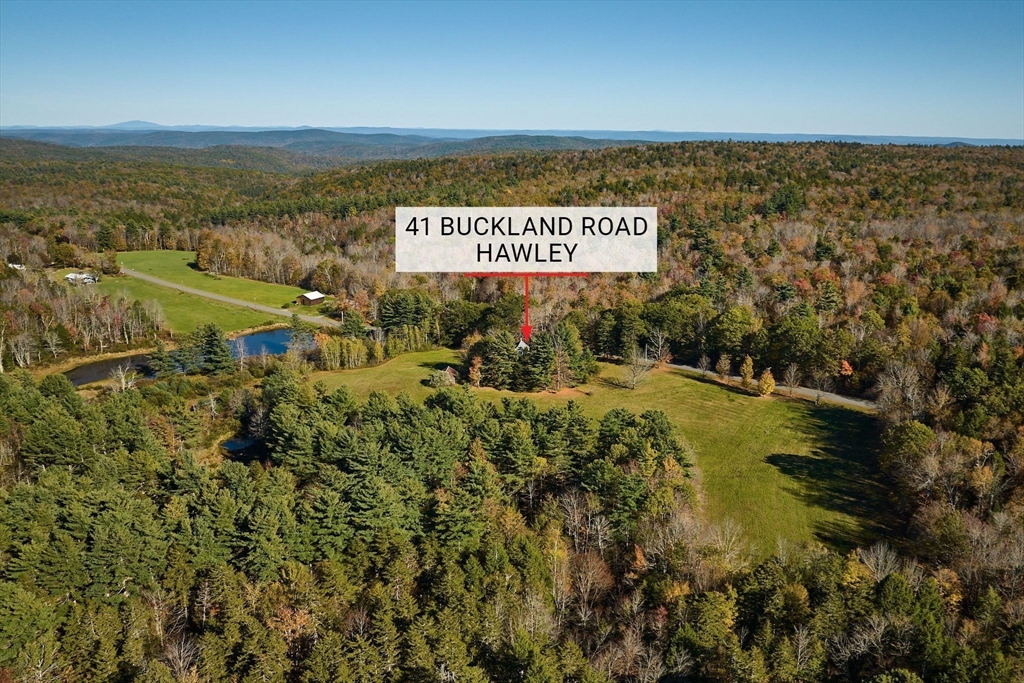 41 Buckland Road Hawley, MA 01339 - Photo 7 of 42 a view of a ocean with a building in the background
