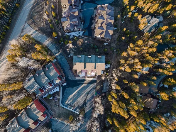 a backyard of a house with lots of tree