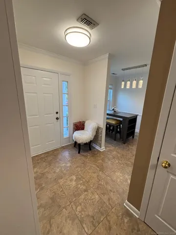 a living room with furniture and a bathroom