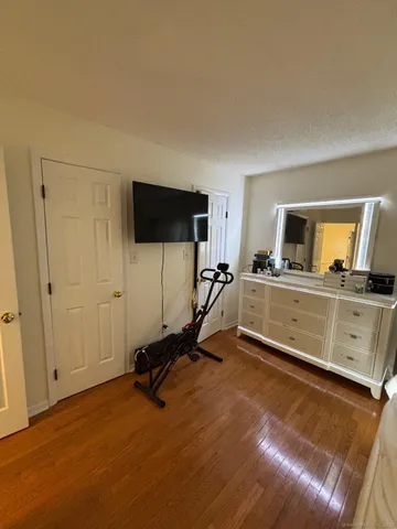 a view of a livingroom with furniture and a flat screen tv