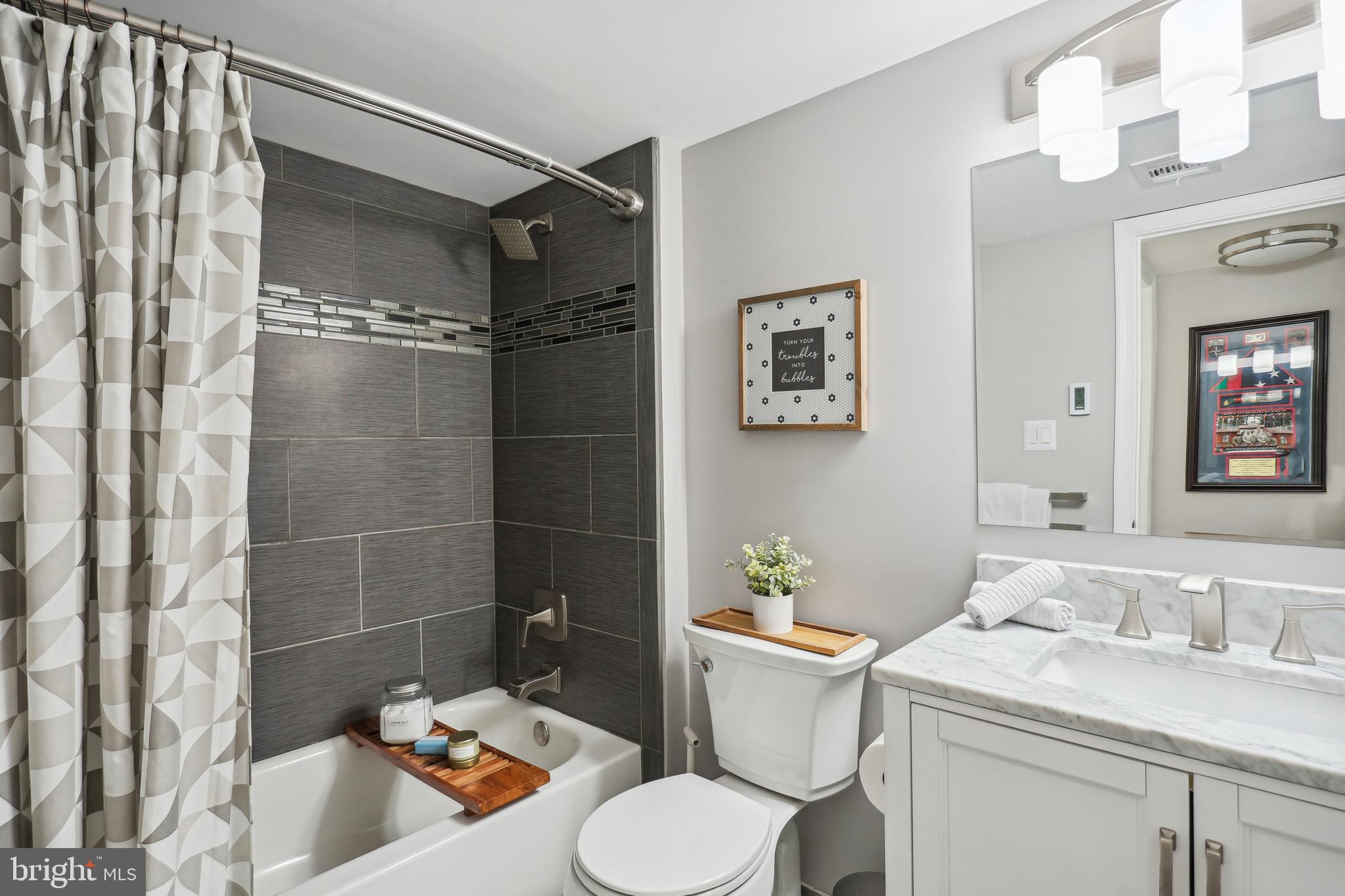 8922 Applecross Lane Springfield, VA 22153 - Photo 17 of 25 Hall Bathroom: heated floors and marble vanity