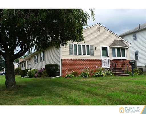 101 Stelton Road Piscataway, NJ 08854 - Photo 1 of 13 a view of a house with a yard and sitting area