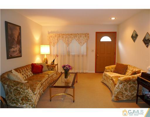 101 Stelton Road Piscataway, NJ 08854 - Photo 3 of 13 a bedroom with furniture and a bed