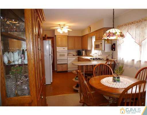 101 Stelton Road Piscataway, NJ 08854 - Photo 5 of 13 a view of a dining room with furniture and chandelier