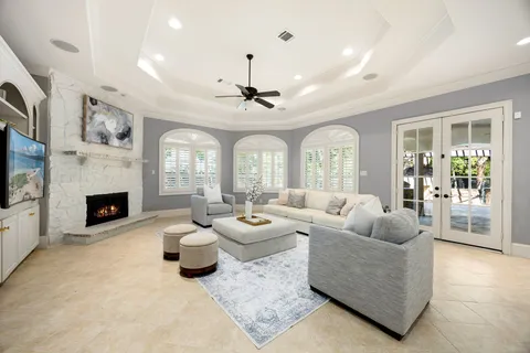 an aerial view of a house with swimming pool and outdoor space