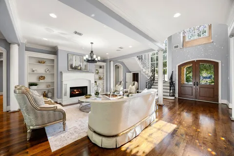 a view of a dining room with furniture wooden floor and chandelier