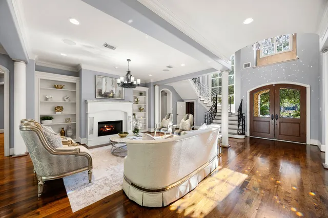 a view of a dining room with furniture wooden floor and chandelier