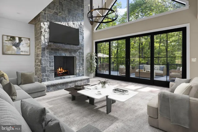 a living room with furniture and kitchen view