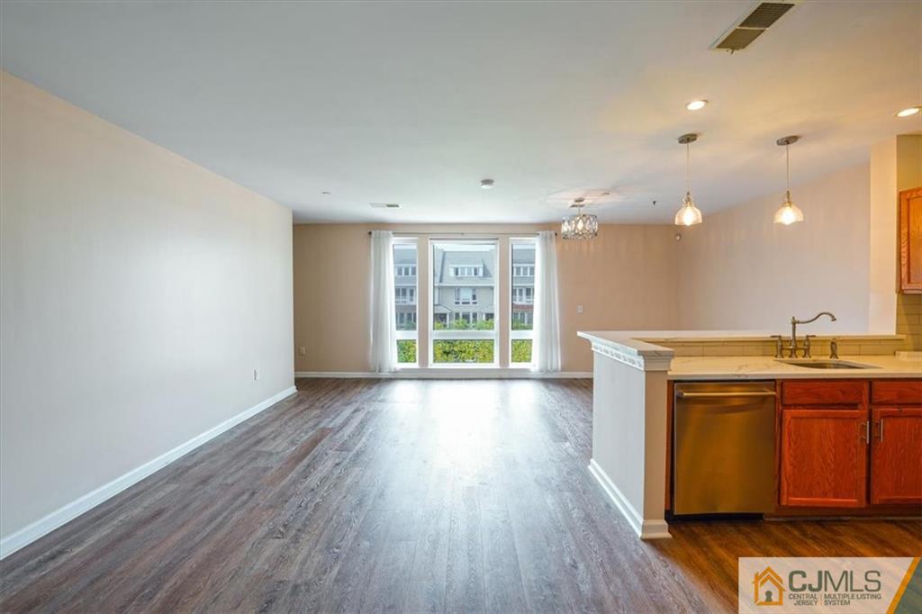 368 Rector Street, Unit 511 Perth Amboy, NJ 08861 - Photo 3 of 16 a view of a room with wooden floor and fan