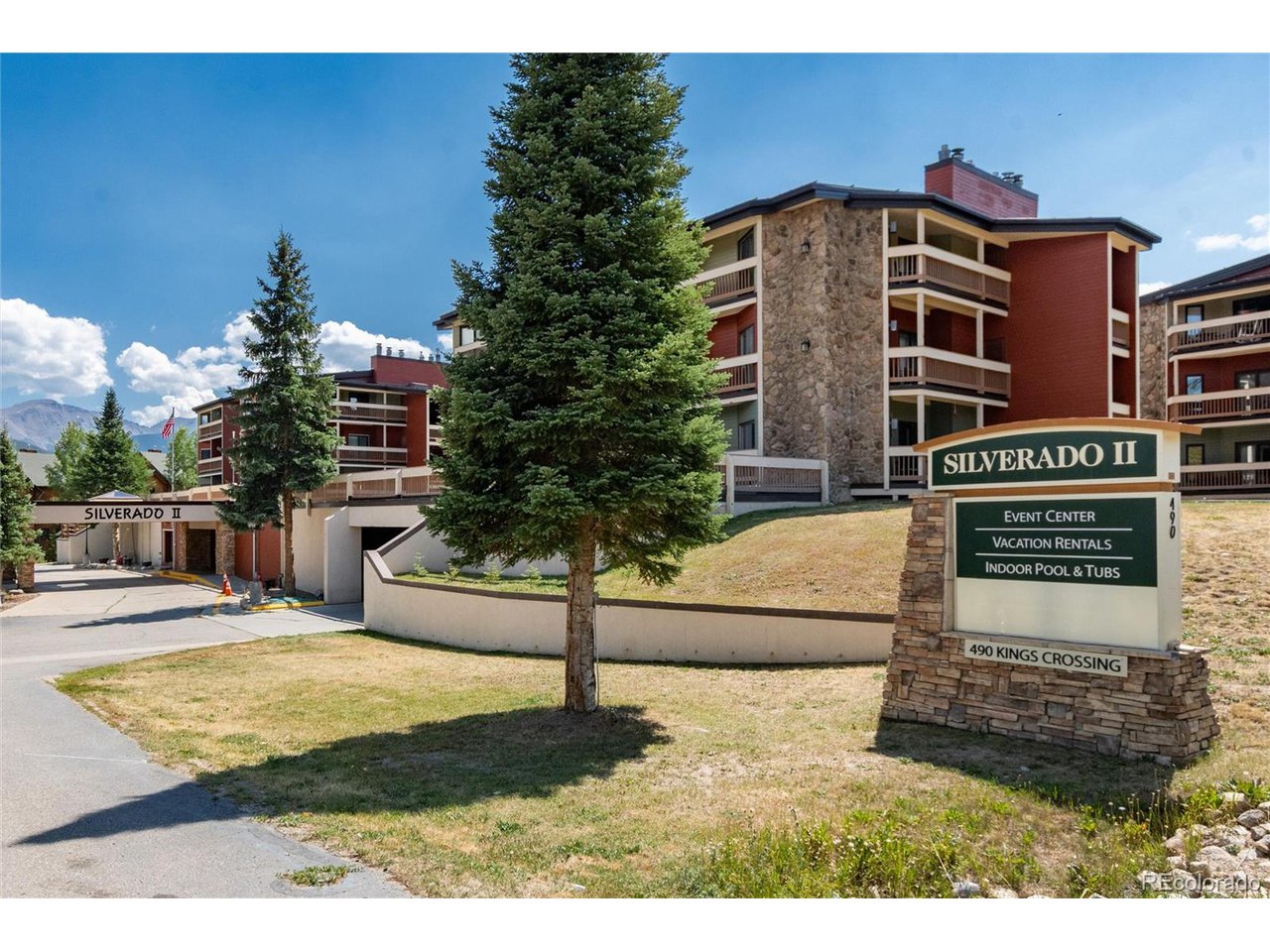 490 Kings Crossing Road, Unit 631 Winter Park, CO 80482 - Photo 1 of 43 a view of a house with backyard and trees