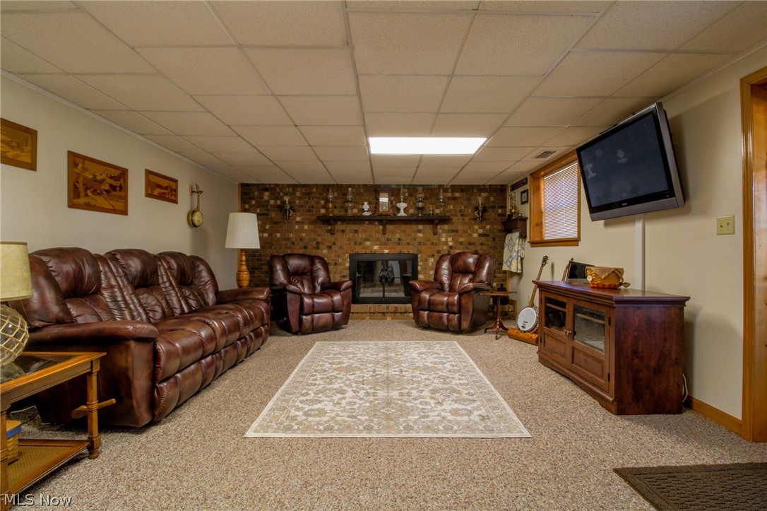 227 Burnfield Road Little Hocking, OH 45742 - Photo 19 of 32 Lower-level family room with woodburning fireplace