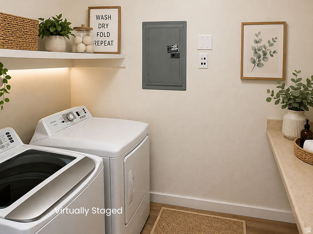 8198 North Cedar Springs Road, Unit T6 Eagle Mountain, UT 84005 - Photo 8 of 13 Dedicated laundry area featuring white appliances, upper shelving with integrated under-shelf lighting, and a neutral countertop