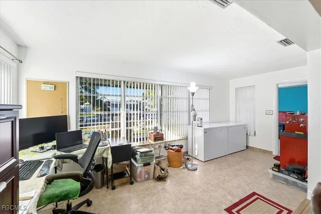 a workspace with furniture and a window