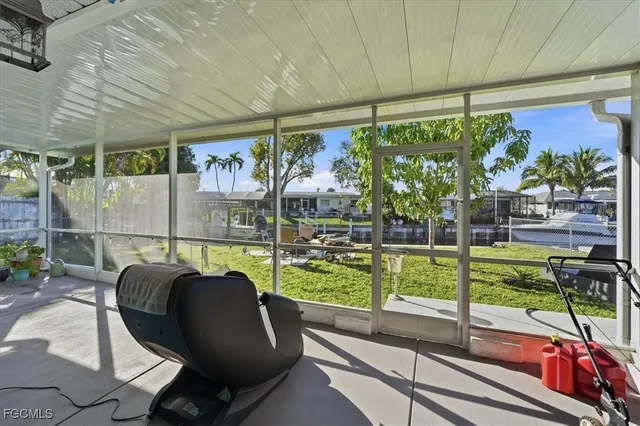 a roof deck with table and chairs under an umbrella