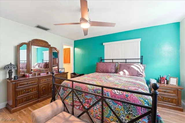 a bedroom with a bed and a dresser