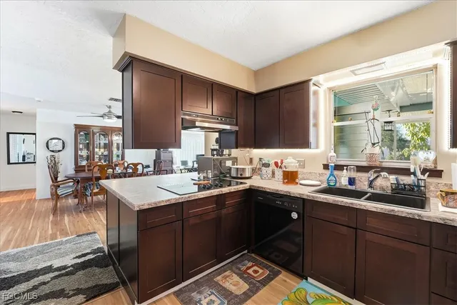 a kitchen with a sink and cabinets