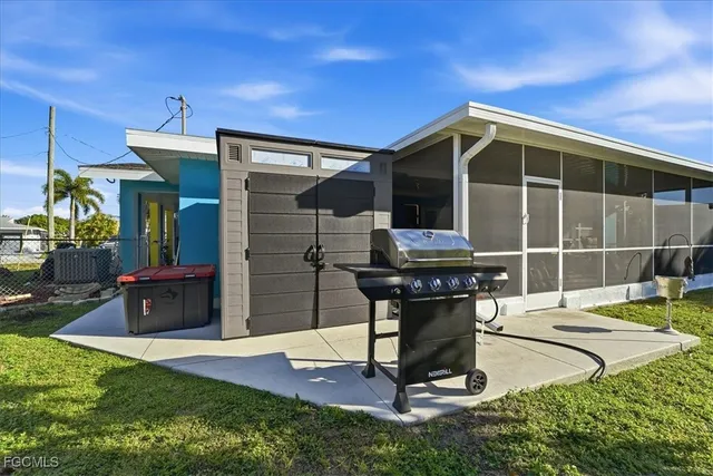 a living room with furniture a flat screen tv and a table