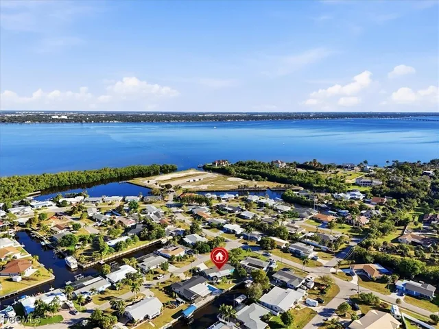 an aerial view of residential building and ocean