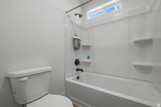 1693 North Center Point Lane Salem, UT 84653 - Photo 17 of 26 Full bathtub and shower combination with dark bronze fixtures and integrated shelving