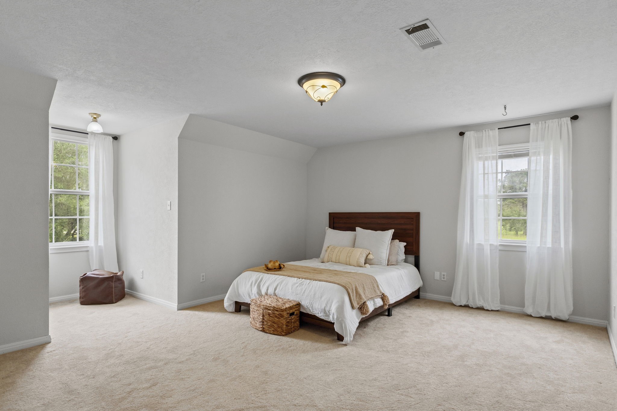 16421 Westbury Road Beaumont, TX 77713 - Photo 23 of 29 a bedroom with a bed and a window