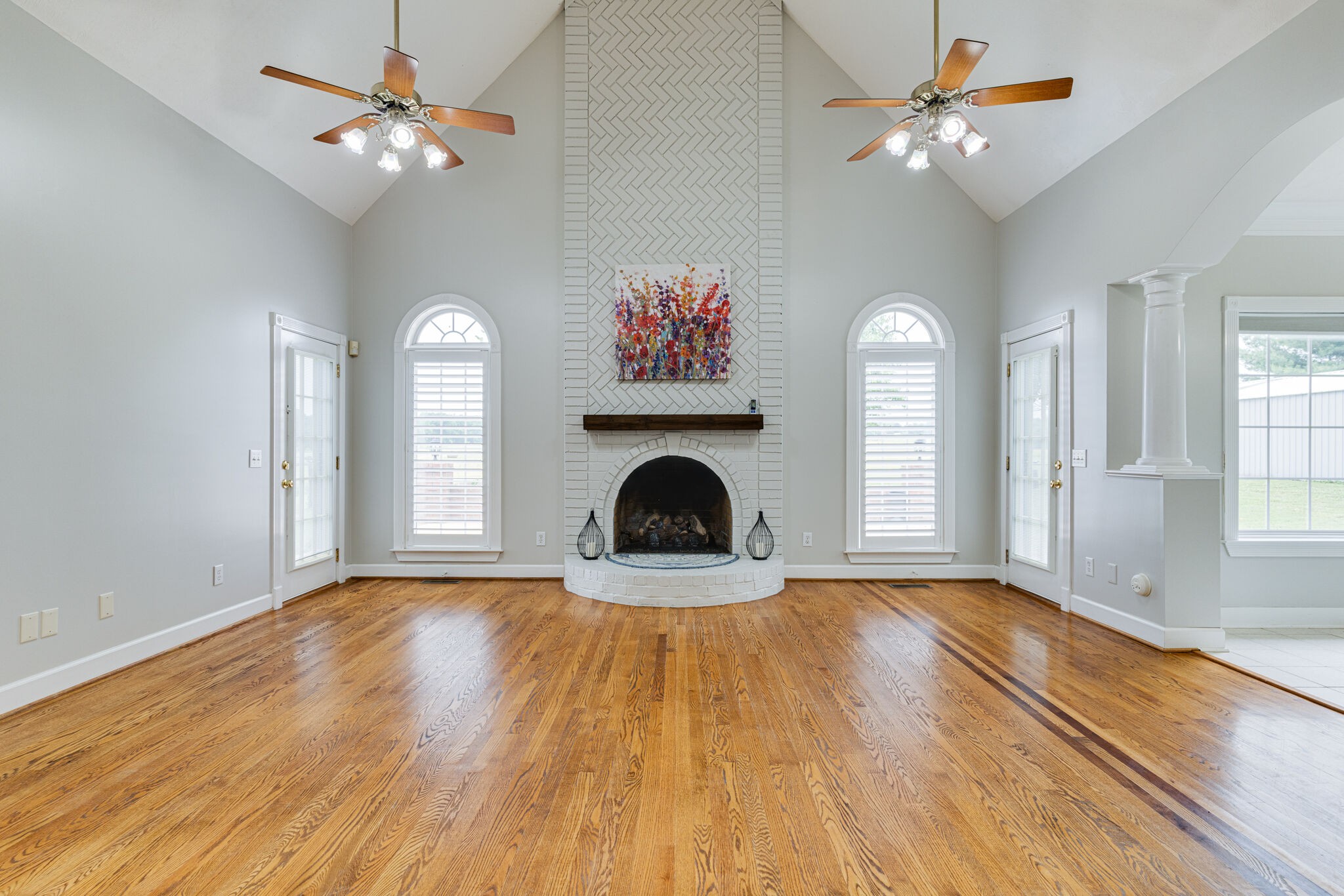 115 Rock Bridge Road Gallatin, TN 37066 - Photo 13 of 70 a view of a livingroom with a fireplace a ceiling fan and a window