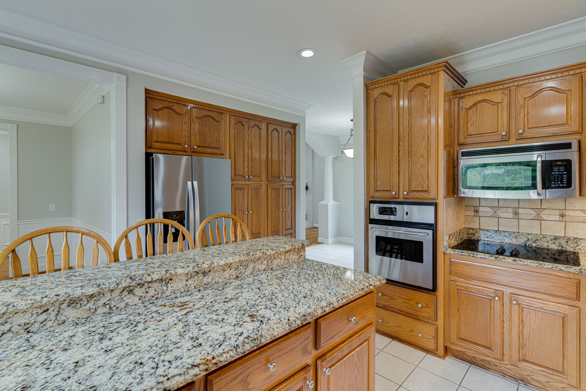 115 Rock Bridge Road Gallatin, TN 37066 - Photo 20 of 70 a kitchen with stainless steel appliances granite countertop a stove a sink and a microwave