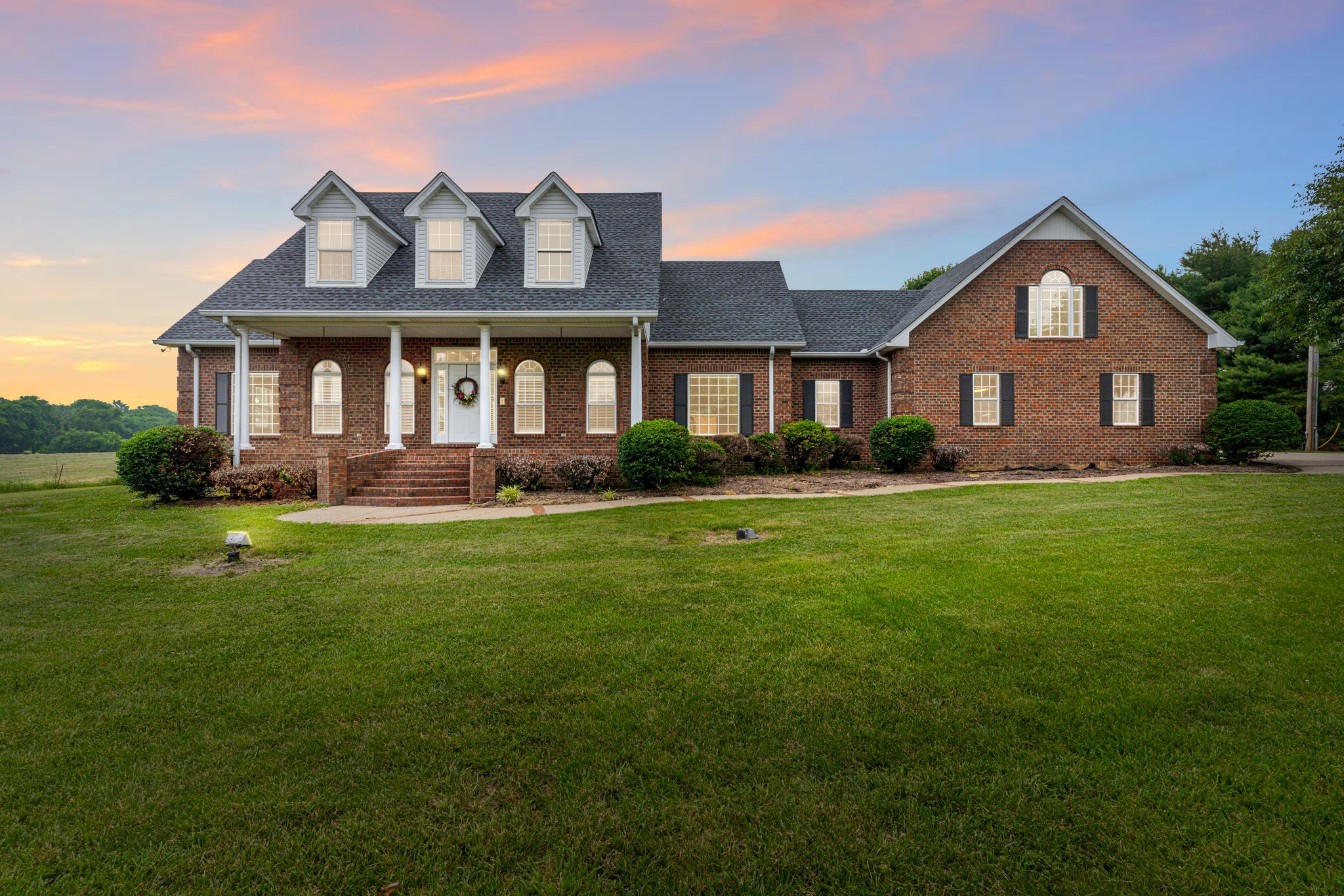 115 Rock Bridge Road Gallatin, TN 37066 - Photo 2 of 70 a front view of a house with a yard and potted plants