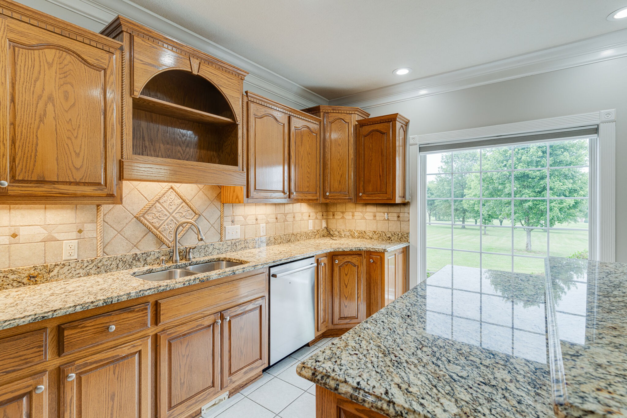 115 Rock Bridge Road Gallatin, TN 37066 - Photo 21 of 70 a kitchen with a sink window and cabinets
