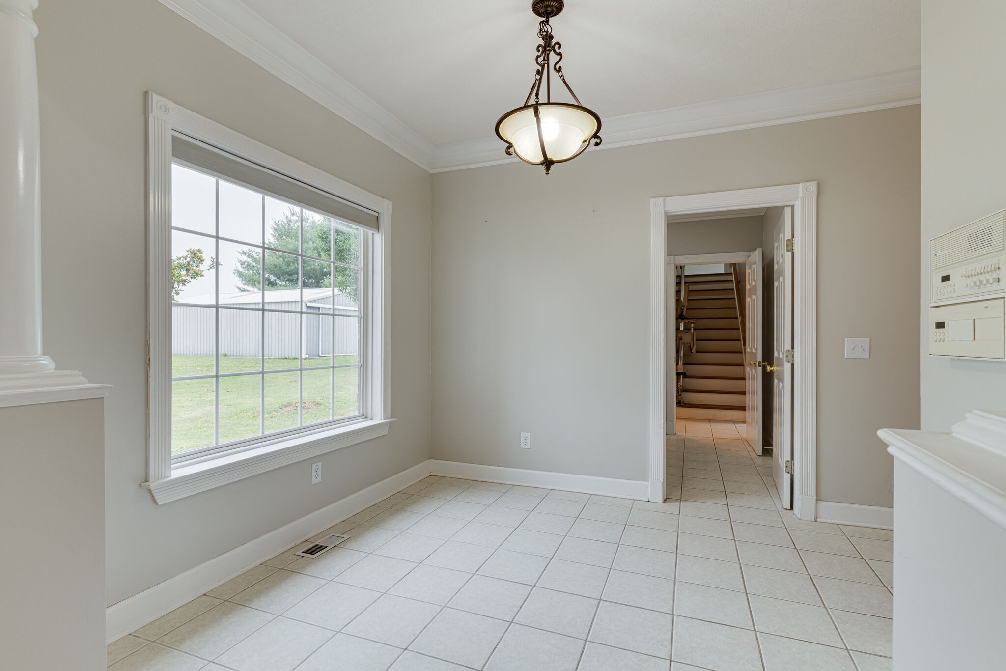115 Rock Bridge Road Gallatin, TN 37066 - Photo 22 of 70 a view of an empty room with window and chandelier fan