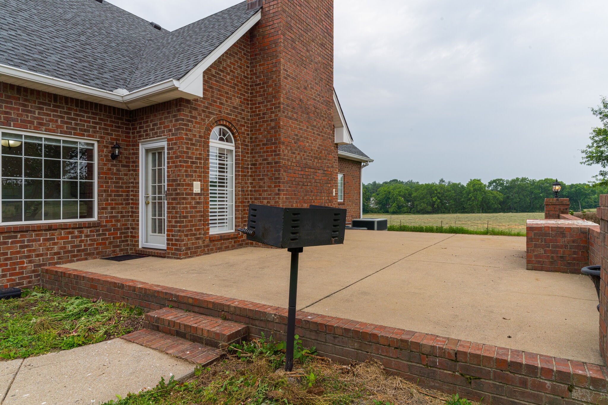 115 Rock Bridge Road Gallatin, TN 37066 - Photo 51 of 70 a front view of a house with yard and trees in the background