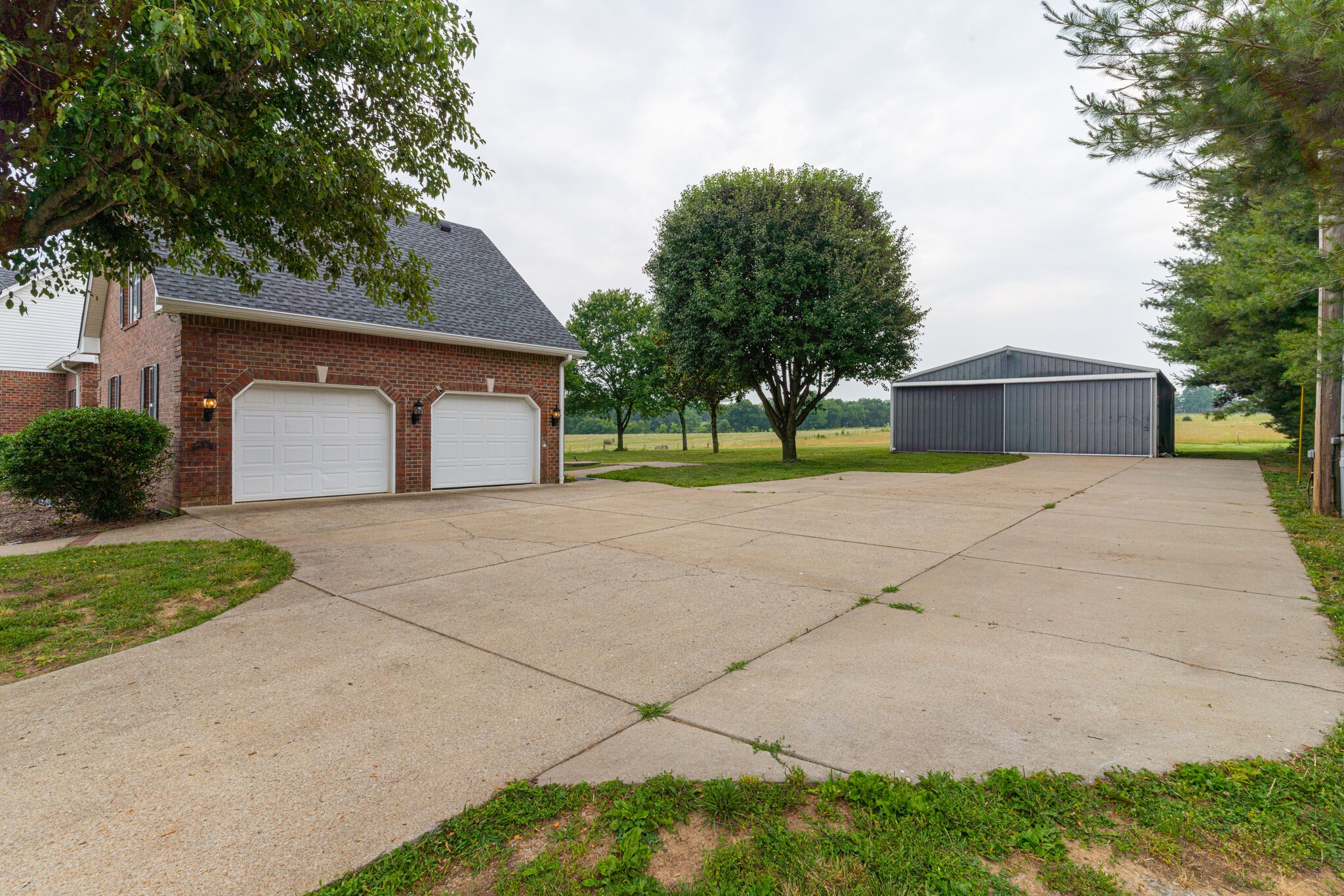 115 Rock Bridge Road Gallatin, TN 37066 - Photo 60 of 70 a front view of a house with a yard and garage