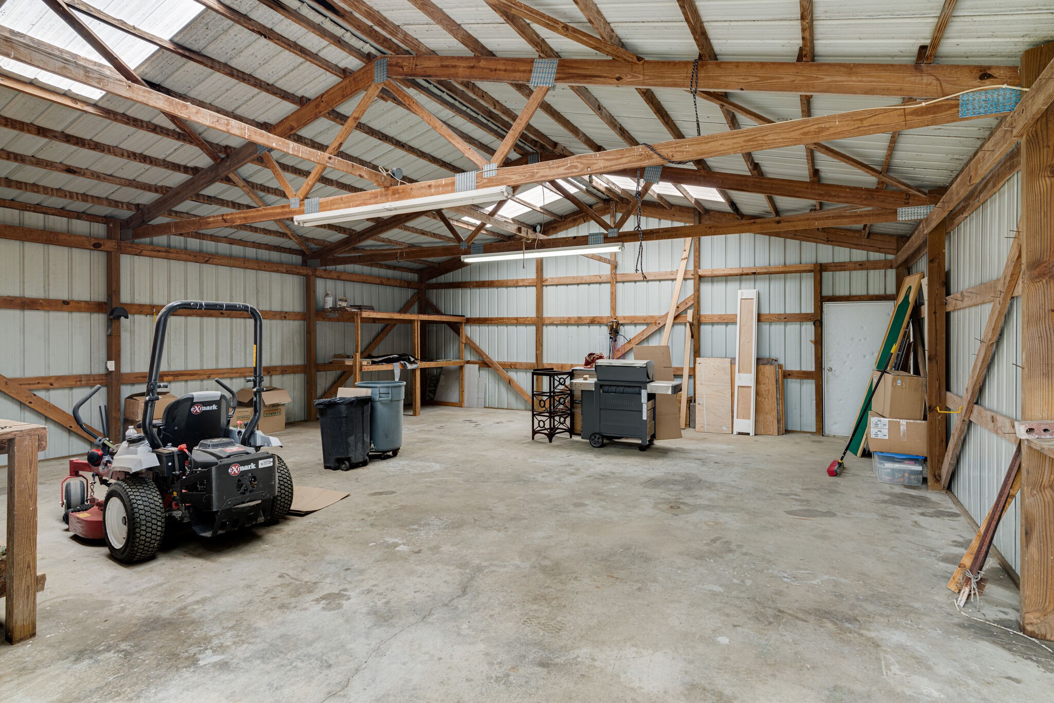 115 Rock Bridge Road Gallatin, TN 37066 - Photo 68 of 70 a view of a garage with a table and chairs