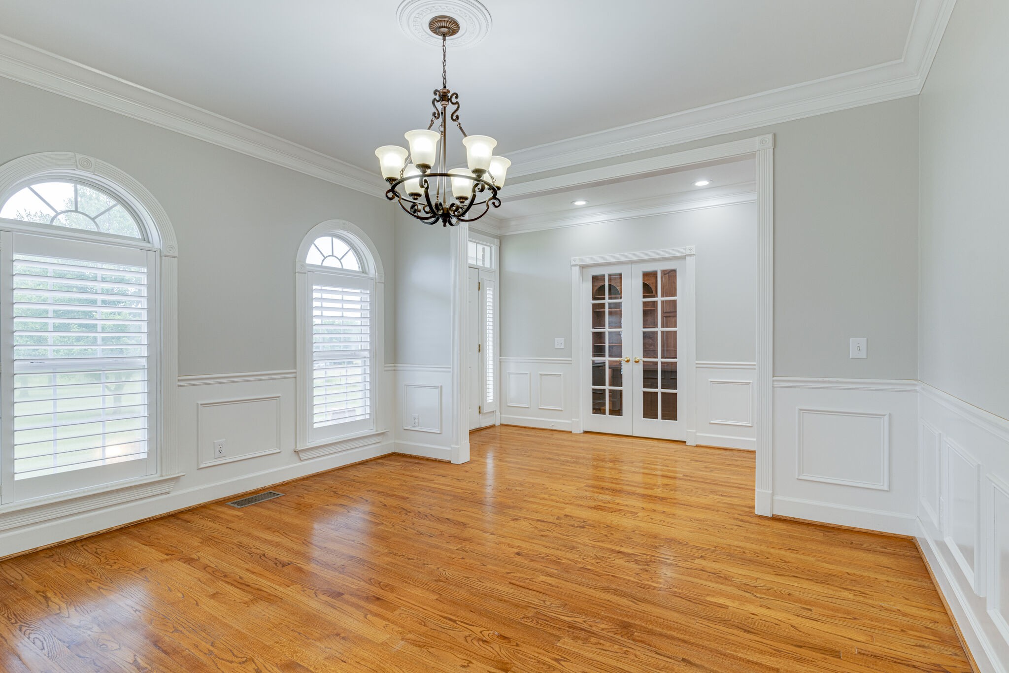 115 Rock Bridge Road Gallatin, TN 37066 - Photo 8 of 70 a view of an empty room with a window and wooden floor