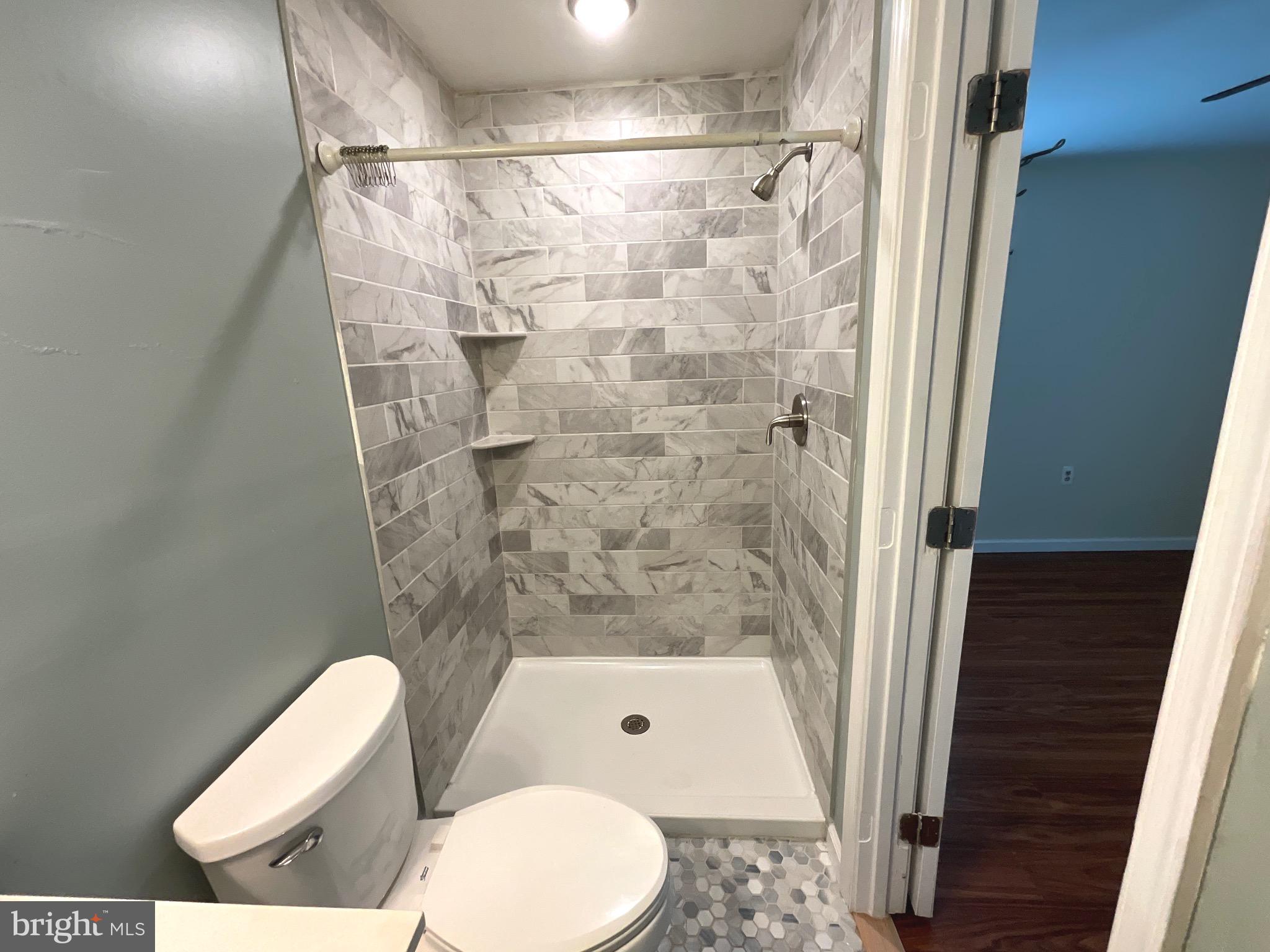 86 Kelley Road Fredericksburg, VA 22405 - Photo 17 of 36 a bathroom with a toilet and shower