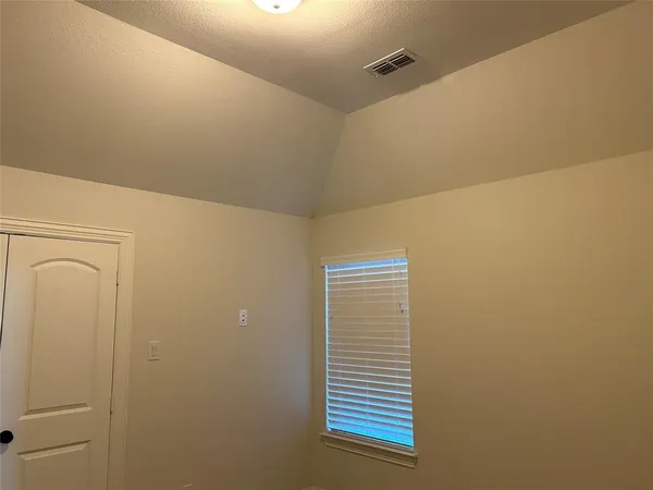 a view of a hallway with washer and dryer