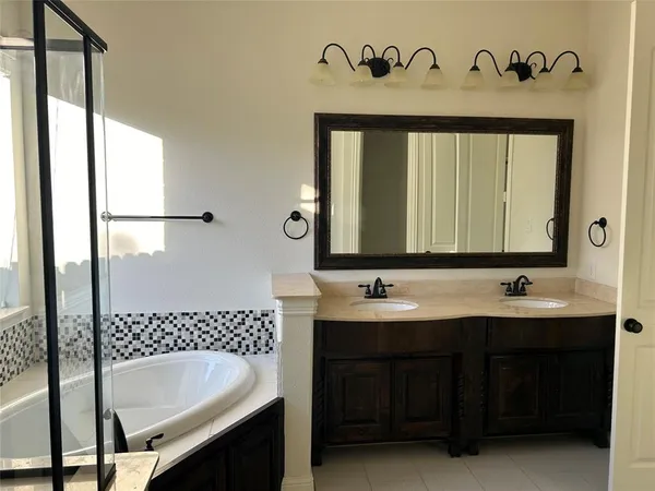 a bathroom with a bathtub and a sink