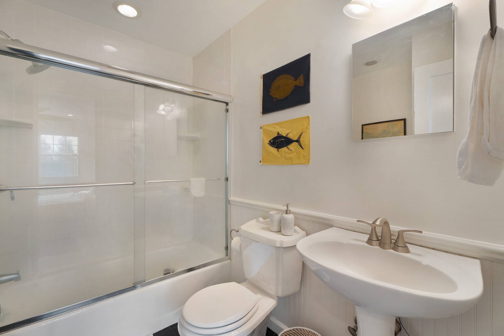 32 Hallock Road East Quogue, NY 11942 - Photo 12 of 24 a bathroom with a sink mirror and toilet