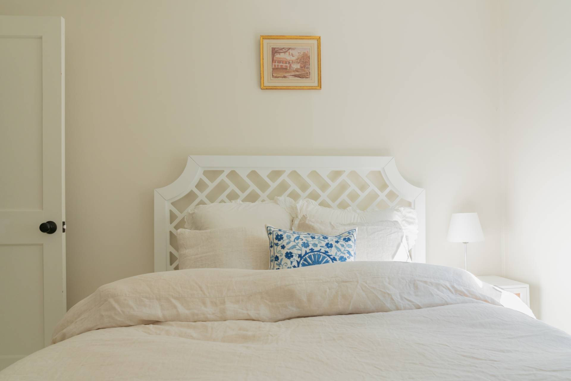 32 Hallock Road East Quogue, NY 11942 - Photo 13 of 24 a bed with a white comforter
