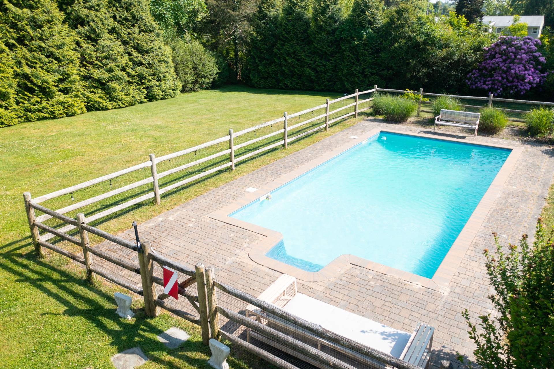 32 Hallock Road East Quogue, NY 11942 - Photo 14 of 24 a view of a swimming pool with a patio