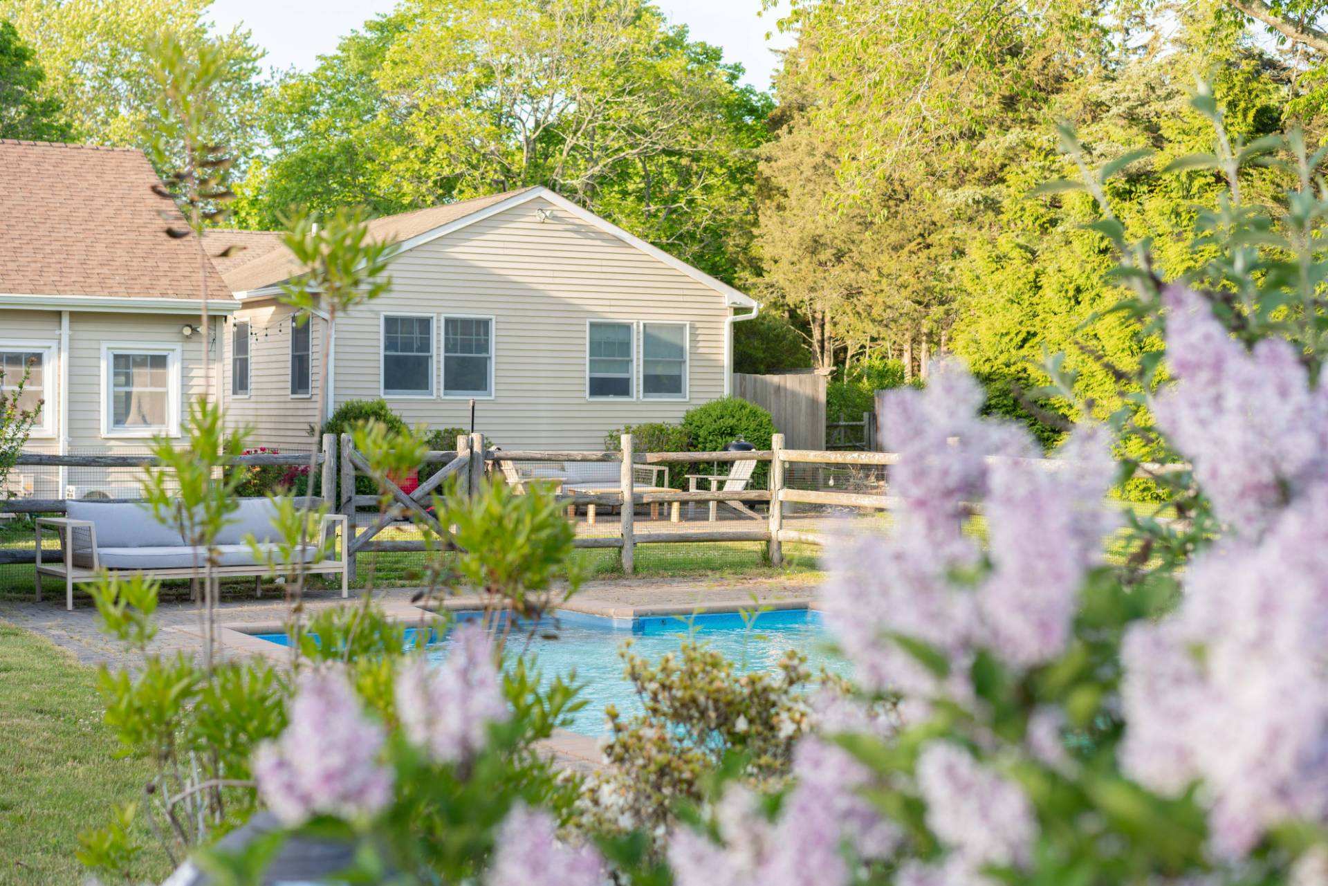 32 Hallock Road East Quogue, NY 11942 - Photo 21 of 24 a house with garden in front of it