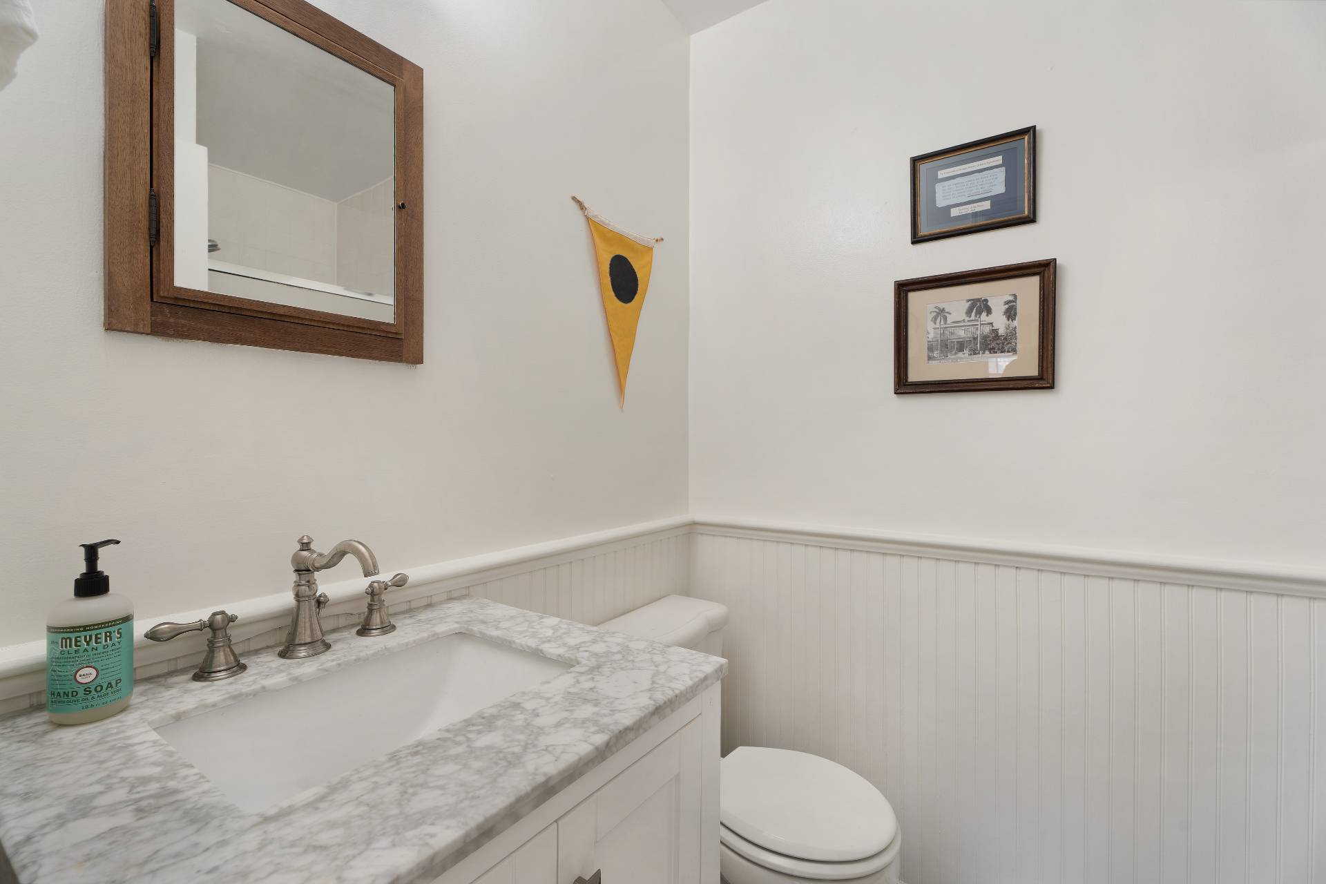 32 Hallock Road East Quogue, NY 11942 - Photo 10 of 24 a bathroom with a granite countertop sink mirror vanity and toilet