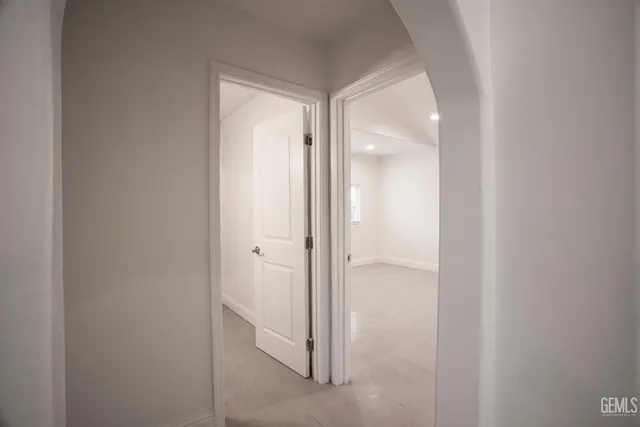 a view of a bathroom from a hallway